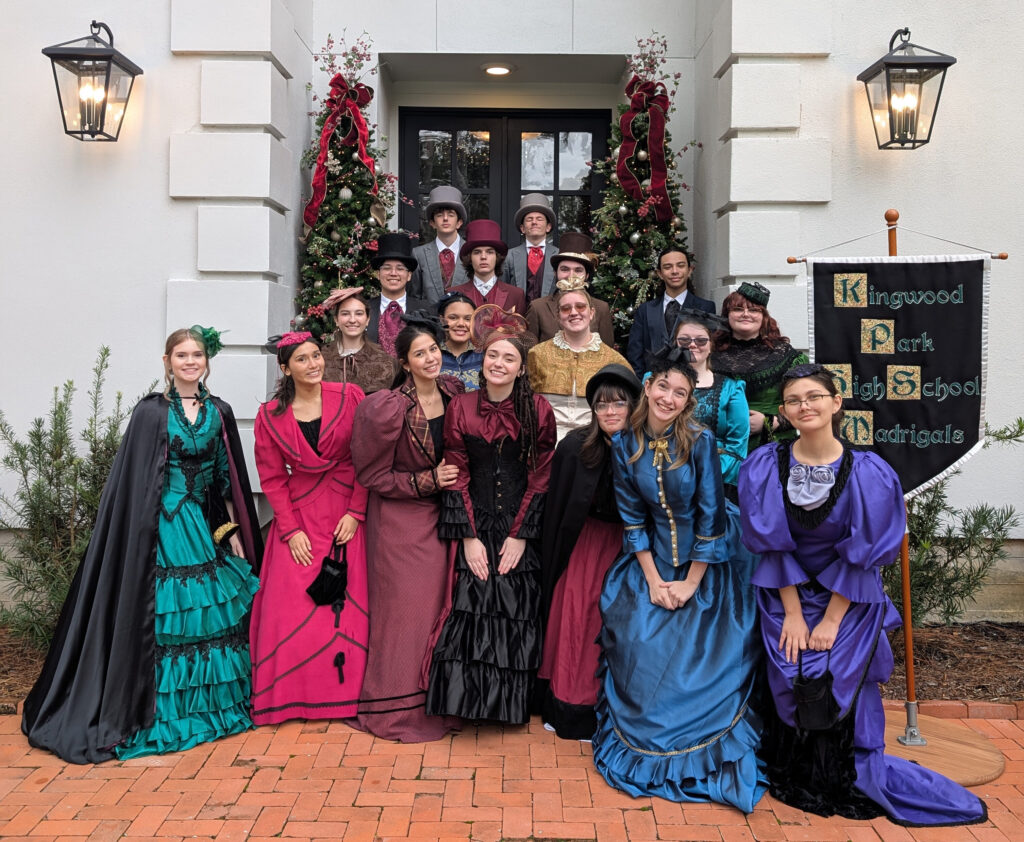 Kingwood Park High School Madrigal Singers wearing traditional Victorian costumes.